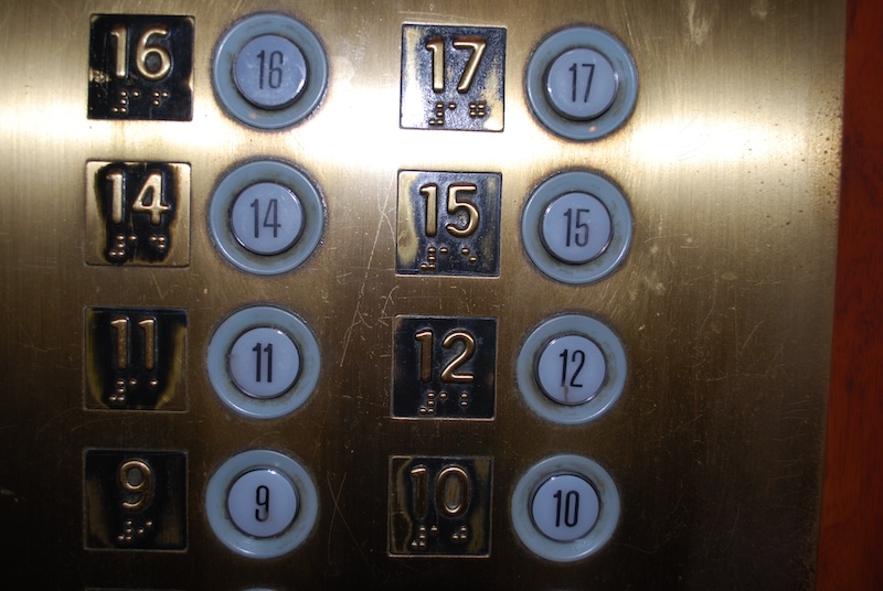 Elevator panel with missing 13th floor button.
