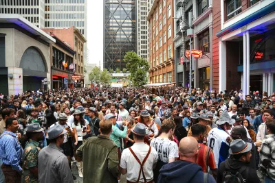 Large crowd on street in San Francisco, California during Oktoberfest festival.