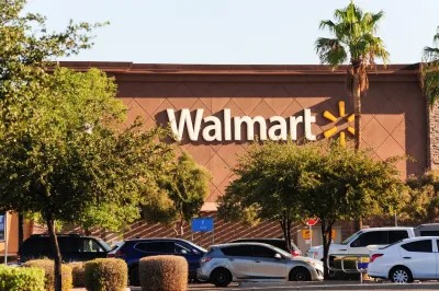 Front of Walmart store with sign.