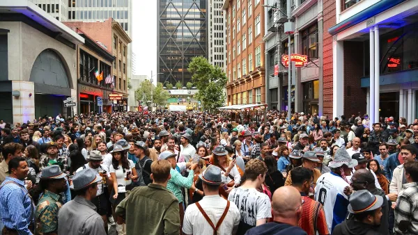 Large crowd on street in San Francisco, California during Oktoberfest festival.