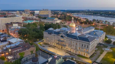 Aerial view of gold-covered New Jersey state capitol dome in Trenton, New Jersey at dusk.