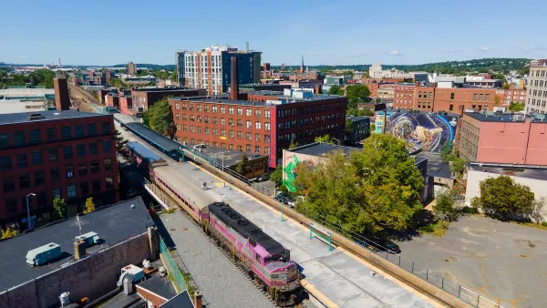 Aerial view of purple MBTA commuter train at station in Lynn, Massachusetts.