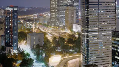 Aerial view of Freeway Park cap park over I-5 interstate freeway in Seattle, Washington at night.