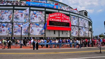 Battle between Cubs and Wrigley rooftops heating up