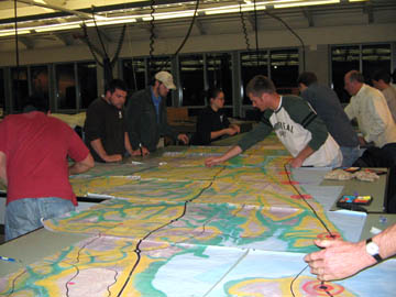 Students work on the assembled tiles.